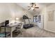 Office space with a treadmill, desk, and lots of natural light at 1015 E Constitution Dr, Gilbert, AZ 85296