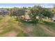 Aerial view of a well maintained park with playground and picnic areas under shade trees at 1015 E Constitution Dr, Gilbert, AZ 85296