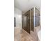 Shower features a glass door, tile surround, and a tiled shower floor at 1015 E Constitution Dr, Gilbert, AZ 85296
