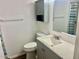 Bathroom featuring a commode, sink, medicine cabinet, and mirror at 10201 N 97Th Ave # B, Peoria, AZ 85345