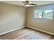 Neutral bedroom with new floors, a ceiling fan and a bright window at 10201 N 97Th Ave # B, Peoria, AZ 85345