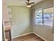 Cozy dining area featuring a window and modern ceiling fan at 10201 N 97Th Ave # B, Peoria, AZ 85345