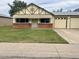 Charming single-story home with a brick accent wall and a well-manicured front lawn at 10201 N 97Th Ave # B, Peoria, AZ 85345