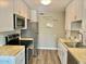 Well-equipped kitchen with stainless appliances and butcher block counters at 10201 N 97Th Ave # B, Peoria, AZ 85345