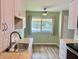 Bright and airy kitchen featuring modern fixtures at 10201 N 97Th Ave # B, Peoria, AZ 85345