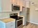 Bright kitchen with butcher block countertops and stainless steel appliances at 10201 N 97Th Ave # B, Peoria, AZ 85345