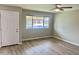 Bright living room with wood flooring and a large window at 10201 N 97Th Ave # B, Peoria, AZ 85345
