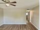 Inviting living room featuring a modern ceiling fan and neutral walls at 10201 N 97Th Ave # B, Peoria, AZ 85345