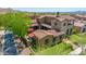 Gorgeous aerial view showcases the home's backyard and outdoor living spaces at 10287 E Diamond Rim Dr, Scottsdale, AZ 85255
