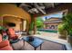 Backyard patio offers comfortable seating and partial view of the private pool at 10287 E Diamond Rim Dr, Scottsdale, AZ 85255