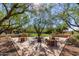Charming community outdoor area with picnic tables shaded by large trees at 10287 E Diamond Rim Dr, Scottsdale, AZ 85255