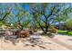 Peaceful community area features outdoor seating and lush landscaping at 10287 E Diamond Rim Dr, Scottsdale, AZ 85255