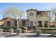 Charming home with stone facade, red tile roof, and meticulously landscaped yard at 10287 E Diamond Rim Dr, Scottsdale, AZ 85255