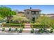 Stunning two-story home with a tile roof nestled in desert landscape and mountain views at 10287 E Diamond Rim Dr, Scottsdale, AZ 85255