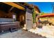 Outdoor living space featuring a hot tub, outdoor furniture, and stone patio flooring at 10287 E Diamond Rim Dr, Scottsdale, AZ 85255