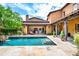 Stunning backyard with pool, tile patio, and exterior views of the main house at 10287 E Diamond Rim Dr, Scottsdale, AZ 85255