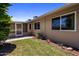 Nice backyard with greenery, pavers and access to the screened-in back patio at 10325 W Prairie Hills Cir, Sun City, AZ 85351