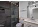 Updated bathroom featuring a sleek glass-enclosed shower, modern fixtures, and stylish design at 10325 W Prairie Hills Cir, Sun City, AZ 85351