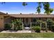 Charming single-story home featuring decorative white metal fencing, mature landscaping at 10325 W Prairie Hills Cir, Sun City, AZ 85351