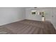 Spacious living room features neutral carpet, and bright natural light at 10325 W Prairie Hills Cir, Sun City, AZ 85351