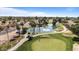Aerial view of the community, showcasing the golf course, lake, and surrounding homes at 1036 S 75Th St, Mesa, AZ 85208