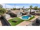 Aerial view of pool, yard, picnic table, and home at 1036 S 75Th St, Mesa, AZ 85208