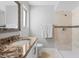 Tiled bathroom featuring a modern vanity with a granite countertop, a shower, and neutral tones at 1036 S 75Th St, Mesa, AZ 85208