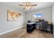 Neutral bedroom features carpet flooring, a ceiling fan, and a window allowing for lots of natural light at 1036 S 75Th St, Mesa, AZ 85208