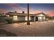 Charming single-story home with desert landscaping and inviting curb appeal at 1036 S 75Th St, Mesa, AZ 85208