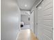 Hallway featuring tile flooring with access to a bedroom and sliding door closets at 1036 S 75Th St, Mesa, AZ 85208