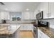 Well-appointed kitchen with granite countertops, modern appliances, and plenty of cabinet space at 1036 S 75Th St, Mesa, AZ 85208