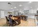 Open-concept kitchen with a breakfast bar, combining dining and cooking spaces seamlessly at 1036 S 75Th St, Mesa, AZ 85208