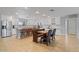 Bright, open kitchen with stainless steel appliances, white cabinetry, and a dining nook at 1036 S 75Th St, Mesa, AZ 85208