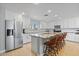 Bright and modern kitchen features white cabinets, stainless steel appliances, and a spacious island at 1036 S 75Th St, Mesa, AZ 85208