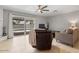 Open living room showcasing sliding glass doors, neutral furniture, and a view of the pool at 1036 S 75Th St, Mesa, AZ 85208