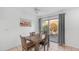 Relaxing dining area with wooden table and chairs next to sliding glass door at 10420 N 10Th St # 2, Phoenix, AZ 85020