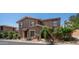 Charming two-story home boasts a red tile roof and well-maintained desert landscaping, offering curb appeal at 10420 N 10Th St # 2, Phoenix, AZ 85020
