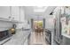 Kitchen with granite countertops and stainless steel appliances and a dining area at 10420 N 10Th St # 2, Phoenix, AZ 85020