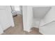 Carpeted staircase leads to the upper level with the bedrooms at 10420 N 10Th St # 2, Phoenix, AZ 85020