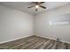 Bedroom featuring ceiling fan, neutral paint and modern vinyl plank flooring at 1050 S Stapley Dr # 62, Mesa, AZ 85204