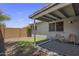 This backyard features an outdoor seating area and a grassy patch for recreation at 1050 S Stapley Dr # 62, Mesa, AZ 85204