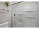 Clean shower featuring sliding glass doors, chrome hardware and built-in shelving at 1050 S Stapley Dr # 62, Mesa, AZ 85204