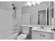 Bathroom featuring white vanity, toilet and shower/tub combination at 115 W El Freda Rd, Tempe, AZ 85284
