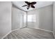 Bedroom with wood-look tile flooring and neutral paint at 115 W El Freda Rd, Tempe, AZ 85284