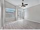 A vaulted ceiling and ceiling fan add to this bedroom's spacious, bright atmosphere at 115 W El Freda Rd, Tempe, AZ 85284