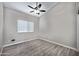 Bedroom with wood-look tile flooring and neutral paint at 115 W El Freda Rd, Tempe, AZ 85284