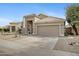 Stylish single-story home featuring a two-car garage, desert landscaping, and well-maintained curb appeal at 115 W El Freda Rd, Tempe, AZ 85284