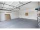 Spacious garage with high ceilings, white walls, and plenty of room for storage at 115 W El Freda Rd, Tempe, AZ 85284
