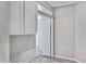 Bright hallway features white cabinets and a door leading to another room at 115 W El Freda Rd, Tempe, AZ 85284