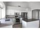 An additional view of the Kitchen featuring white cabinets and stainless steel appliances at 115 W El Freda Rd, Tempe, AZ 85284